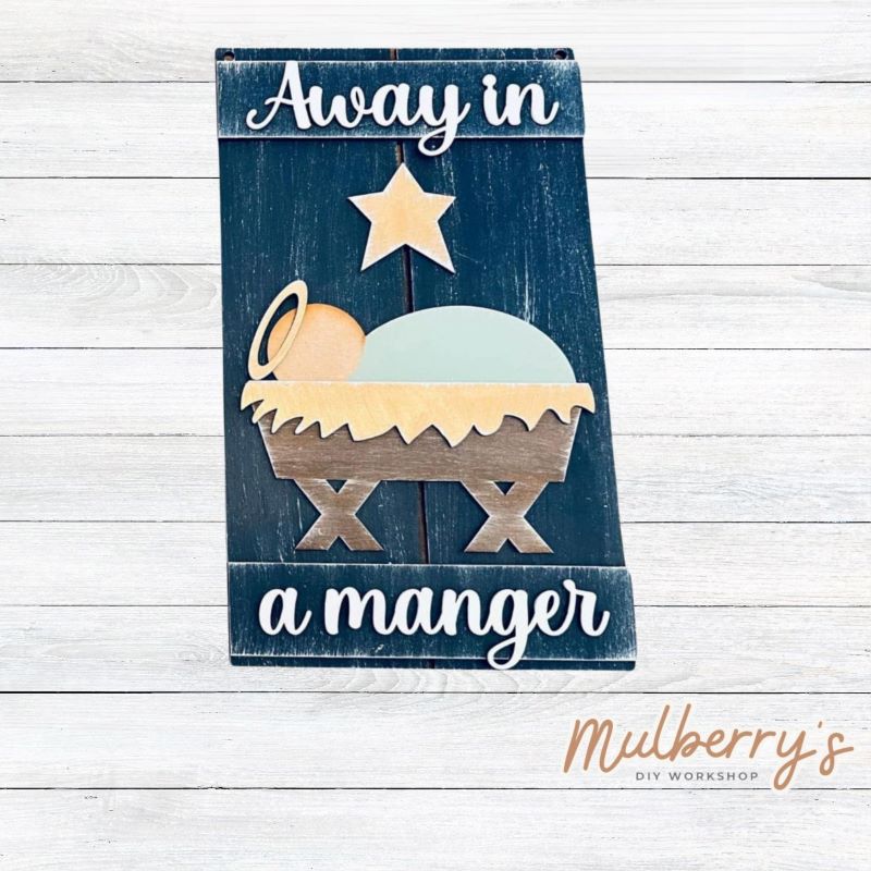 Our Away in a Manger mini door hanger is perfect for Christmas! Approximately 12" tall by 8" wide.