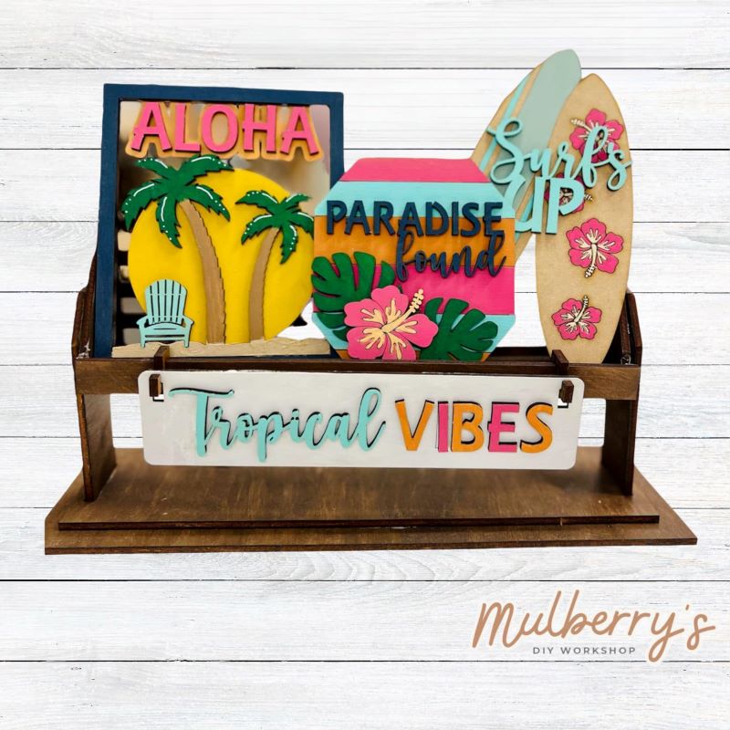 It doesn't get any cuter than our little rustic crate! It's a perfect add on accessory to your décor. It's approximately 13" long.  Includes: Crate and Beach Inserts.  Beach inserts include Aloha, Paradise Sign, Surfboard, and the Tropical Vibes banner.