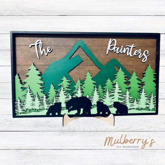 Our georgous 5-layered mountain and bear scene will surely spruce up your home! You may personalized the sign with your family's last name. Size is approximately 10 inches tall by 18 inches wide. Optional stand is available to purchase.