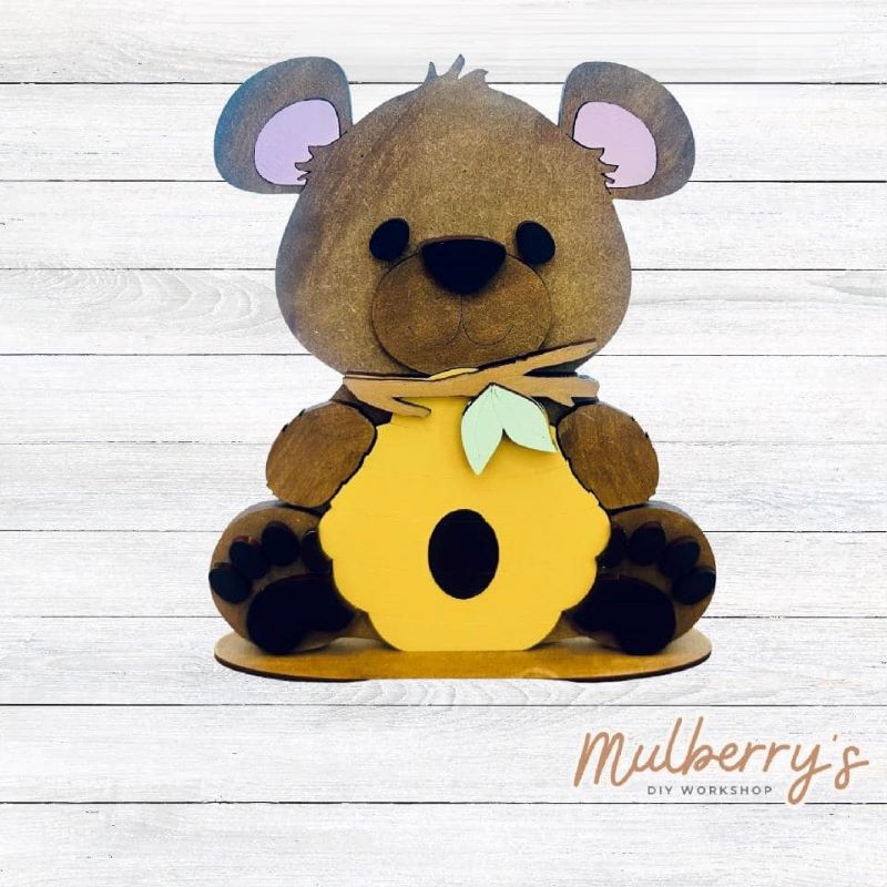 Our adorable little bear with honeycomb is bee-tastic! Approximately 7.5" tall by 7" wide. Includes stand.