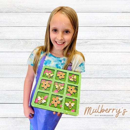 Your child will love playing tic-tac-toe with our flowers & bees tic-tac-toe board! Approximately 10.5" tall by 10.5" wide. Includes 5 flowers and 5 bees.