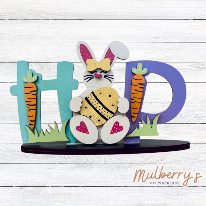 HOP into Easter with this adorable shelf sitter! Approximately 4.5" tall by 7.5" wide. Stand is included.