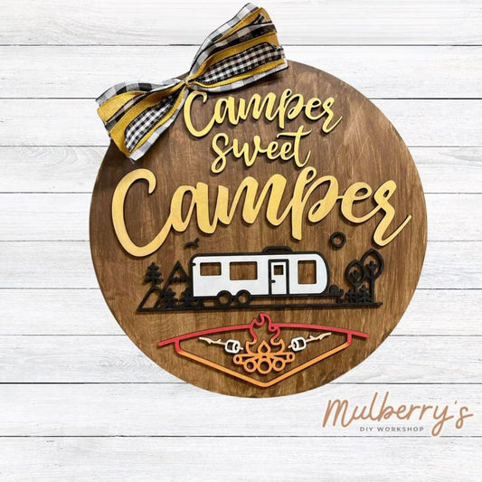 Needing a door hanger for your camper? We have you covered with our Camper Sweet Camper 18-inch door hanger. There are two types of campers to choose from: pull-behind camper and 5th wheel.