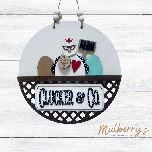 Welcome family and friends with our interchangeable lattice round door hanger! Simply swap out inserts to match the different holidays and seasons! It's approximately 10.5" in diameter.  Includes: Lattice Round Door Hanger with Chicken Inserts. Additional inserts are available to purchase.