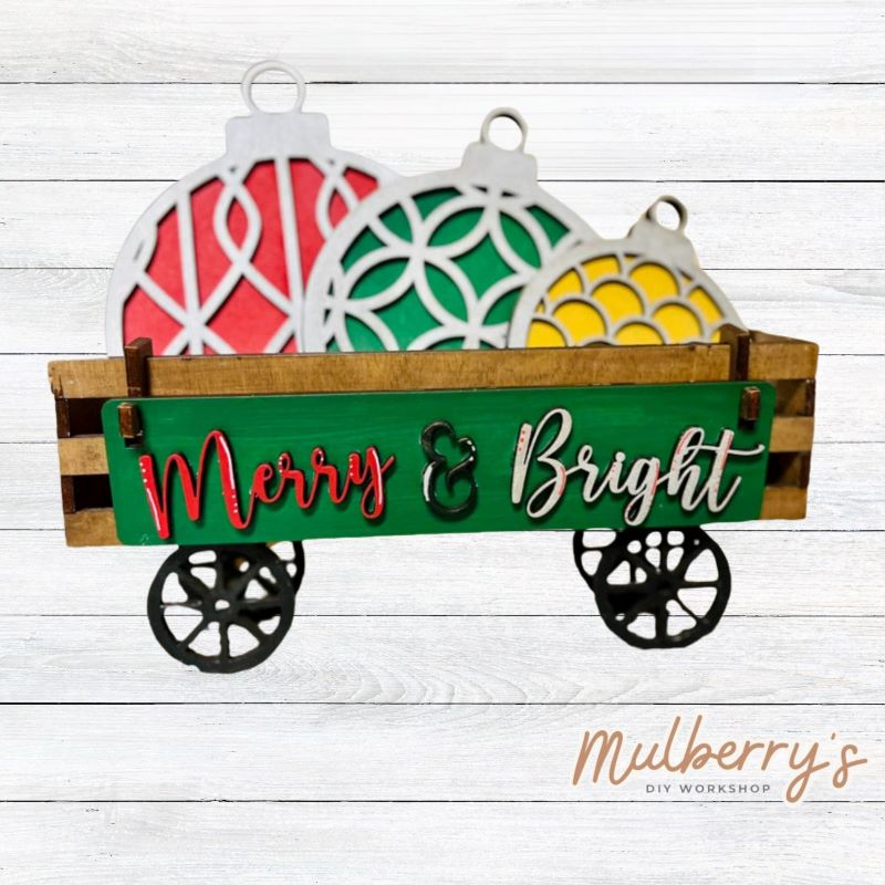 It doesn't get any cuter than our little rustic wagon! It's a perfect add on accessory to your décor. It's approximately 4" tall x 12" wide.  Includes: Wagon and Christmas Ornaments Inserts. Christmas Ornaments inserts include three ornaments and the Merry & Bright banner.