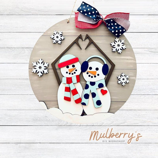 Our 18" charming snowman couple door hanger will melt your heart! It's perfect to display for winter and Valentine's Day.