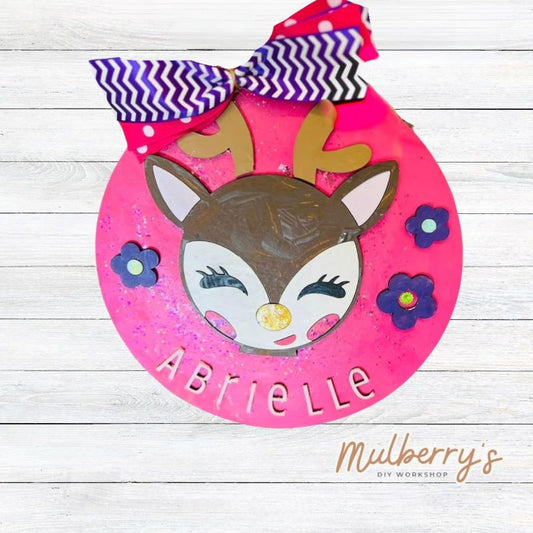 Our adorable mini 9.5" door hanger with a deer and flowers is a popular project for kids! This design can be personalized with a name in either print or cursive.