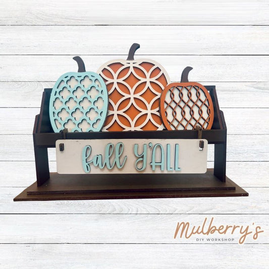 It doesn't get any cuter than our little rustic crate! It's a perfect add on accessory to your décor. It's approximately 13" long.  Includes: Crate and Fall Inserts. Fall inserts include three pumpkins and the Fall Y'all banner.