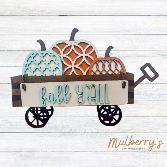 It doesn't get any cuter than our little rustic wagon! It's a perfect add on accessory to your décor. It's approximately 4" tall x 12" wide.  Includes: Wagon and Fall Inserts.  Fall inserts include three pumpkins and the Fall Y'all banner.