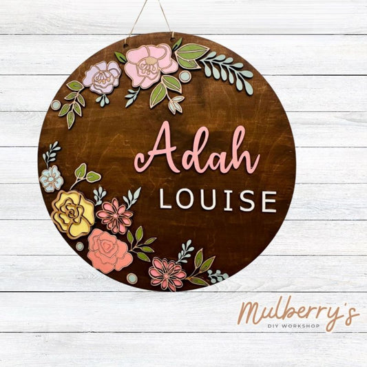 Decorate your little one's nursery with our personalized floral nursery 22" door hanger!