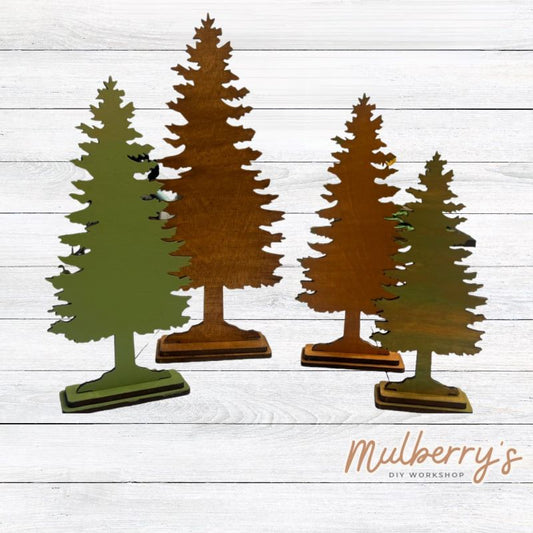 Decorate your home or cabin with our forest trees! Includes two taller trees at approximately 10.5" tall and two shorter trees at approximately 8.5" and 7." Four trrees in total are included in this set.