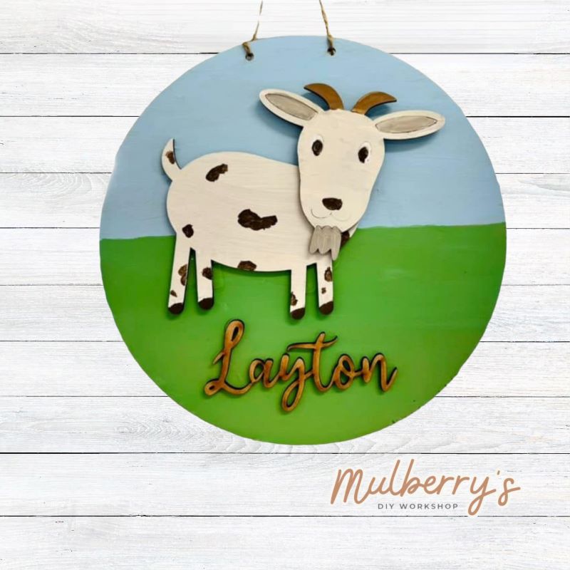 It doesn't get any baaa than our personalized 9.5" mini goat door hanger!