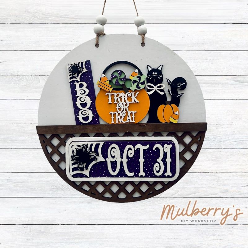 Welcome family and friends with our interchangeable lattice round door hanger! Simply swap out inserts to match the different holidays and seasons! It's approximately 10.5" in diameter. Includes: Lattice Round Door Hanger with Halloween Inserts. Additional inserts are available to purchase.