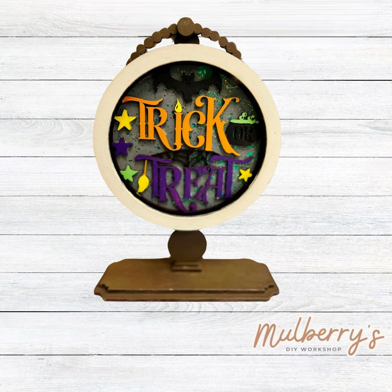 We love our interchangeable tabletop! It's approximately 10" tall and can display your favorite seasonal/holiday insert. This set includes the interchangeable tabletop and the trick or treat insert.