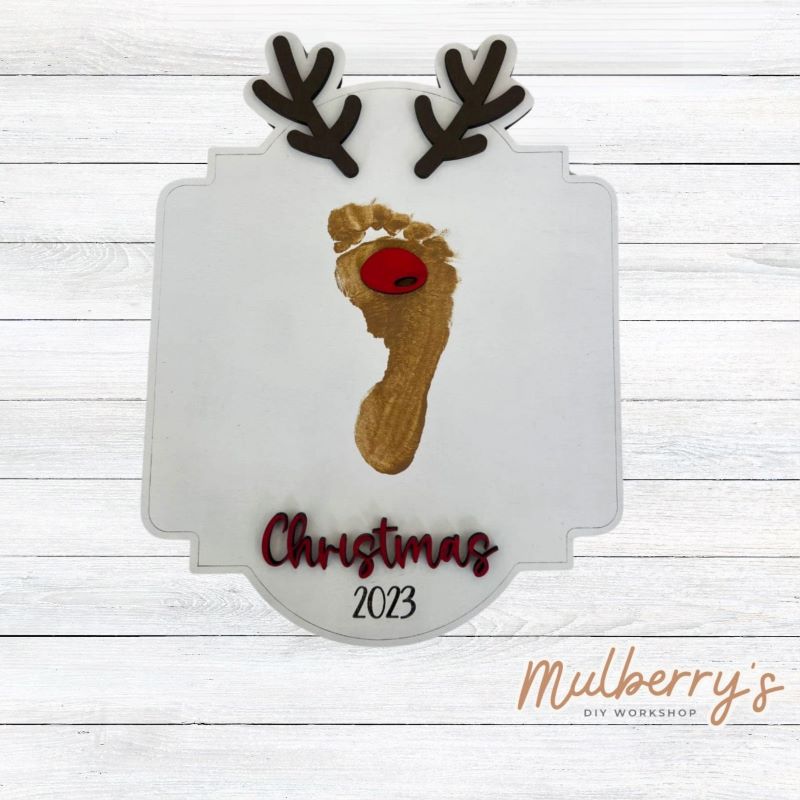 Let your little one personalize our cute reindeer footprint sign! Approximately 12" tall. Optional stand is available.