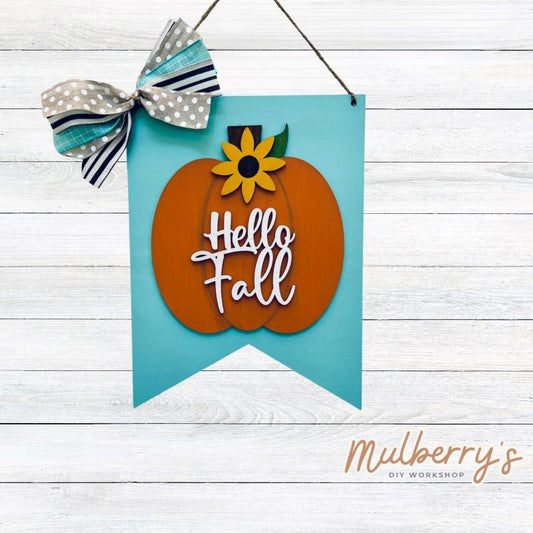 Our hello fall pumpkin mini door hanger is a popular fall project! Approximately 14" tall by 10" wide.
