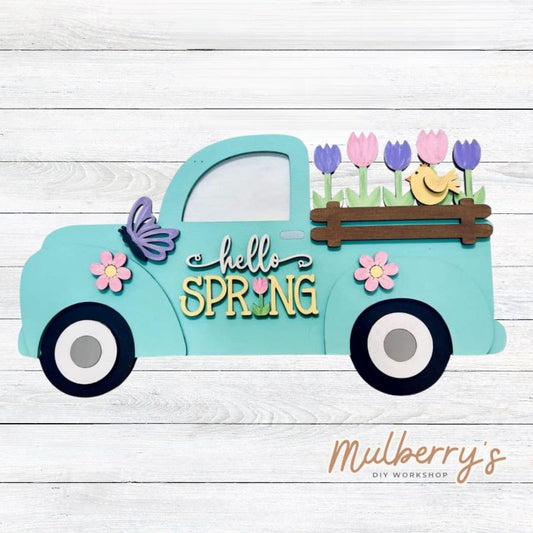 Our hello spring farmhouse truck is too cute! Approximately 7" tall by 12" wide.