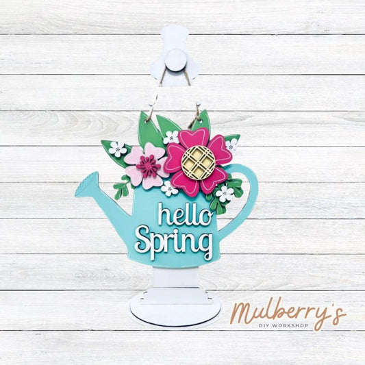 Our cheerful "Hello Spring" mini door hanger is a perfect addition for spring.  It's approximately 12" tall by 10.5" wide with multiple layers of flowers.