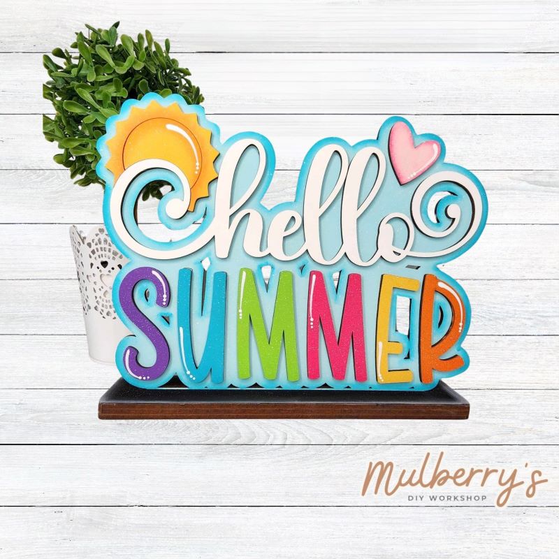 Our Hello Summer shelf sitter is the perfect addition to your summer decor! Approximately 9" wide by 6" tall. Includes stand.