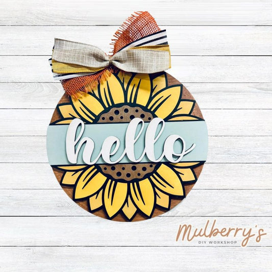 Our hello sunflower mini door hanger is so much fun to paint! Approximately 10.5" in diameter.