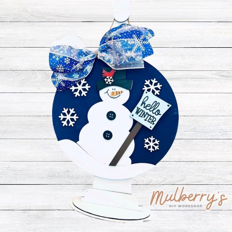 Our hello winter snowman mini door hanger is snow much fun to paint! Approximately 10.5" in diameter.