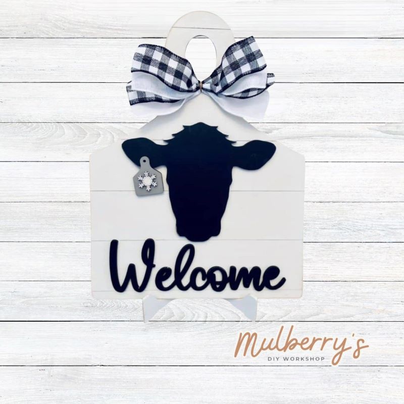 Our interchangeable cow cutting board is approximately 11" tall and includes 10 ear tags. Optional stand is available.