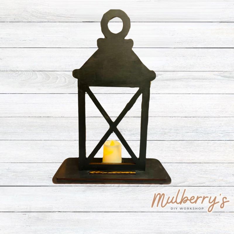 We love our interchangeable lantern! It's approximately 11" tall and can display your favorite seasonal/holiday insert.