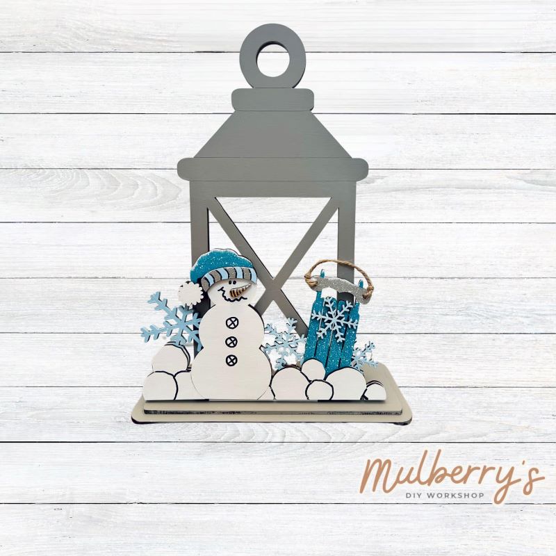 We love our interchangeable lantern! It's approximately 11" tall and can display your favorite seasonal/holiday insert. This set includes the interchangeable lantern and the winter insert.