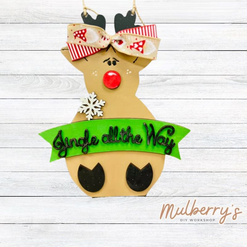 Our "Jingle All the Way" reindeer mini door hanger is so cute! Approximately 16" tall by 6" wide.