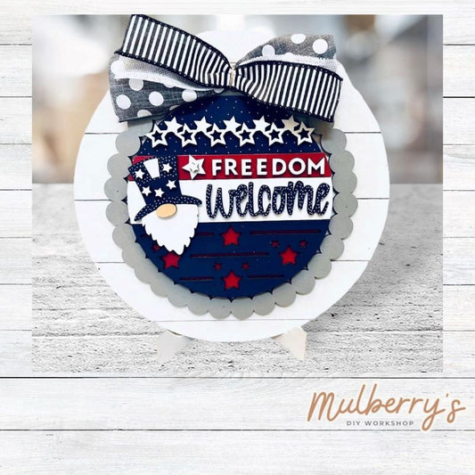 We love our large interchangeable plate with stand! It's approximately 11.5-inches is diameter and can display your favorite seasonal/holiday insert. This set includes the large interchangeable plate with stand and the freedom welcome gnome insert.