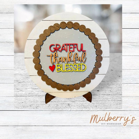 We love our large interchangeable plate with stand! It's approximately 11.5-inches is diameter and can display your favorite seasonal/holiday insert. This set includes the large interchangeable plate with stand and the grateful thankful and blessed insert.