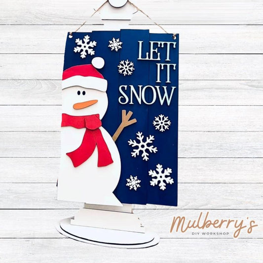 Say it louder for the people in the back...Let It Snow!! Our let it snow mini door hanger is approximately 12" tall by 8" wide.
