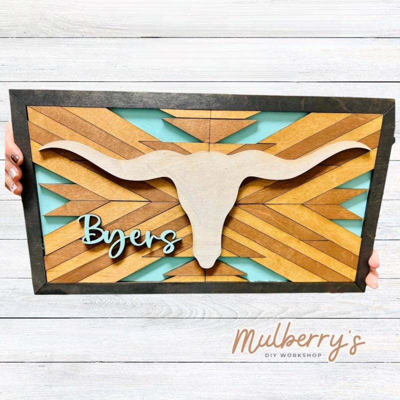 Our personalized barn quilt with longhorn is stunning! It's a complicated project, but so worth it! You may personalize it with a name(s). It measures 11" tall by 18" wide. Optional stand is available.