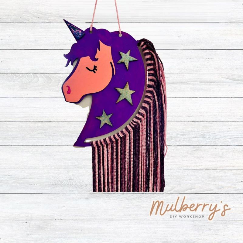 Decorate your child's door with our unicorn macrame door hanger! Approximately 14" tall by 11" wide without yarn attached.