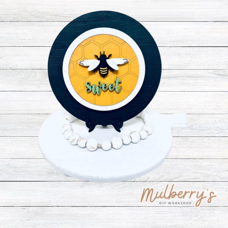 We love our mini interchangeable plate with stand! It's approximately 8-inches is diameter and can display your favorite seasonal/holiday insert. This set includes mini interchangeable plate with stand and bee insert.