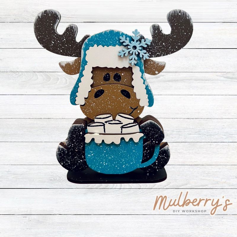 Our mini winter moose shelf sitter is too cute! He's approximately 5" tall and includes a stand.