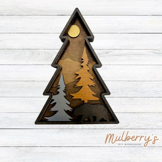 Our multilayered tree with bear is 6 layers and is shaped like a tree with mountains, trees, and a bear. It's roughly 7 inches tall.