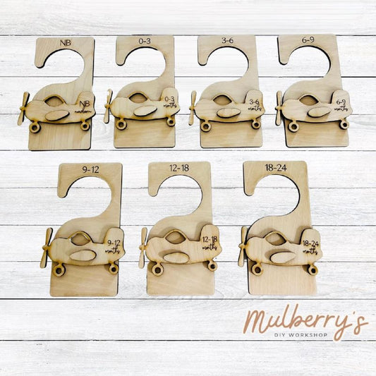 Celebrate the birth of your little one with our aiplane nursery closet organizers! Approximately 8" tall. Set includes 7 closet hangers.