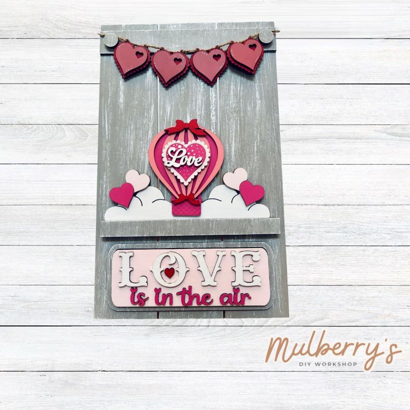 Our Interchangeable Pallet Stand measures roughly 15" tall by 9" wide.  This project can easily be changed out for holidays, seasons and other themes. The set includes the pallet stand and valentine hot air ballon inserts.