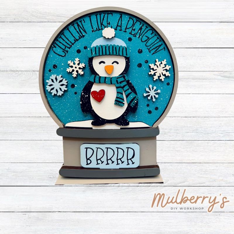 Our interchangeable mini snowglobe is the perfect addition to your seasonal decor! Simply switch out the interchangeable pieces for every holiday/season! Approximately 7" tall by 5.5" wide.