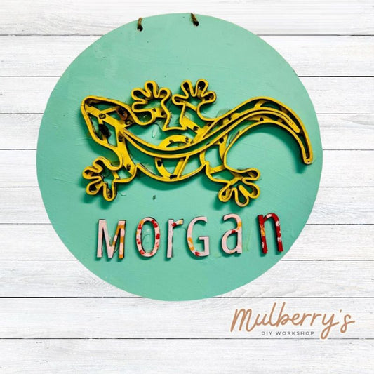 Our mini 9.5" door hanger with a lizard and is a popular project for kids! This design can be personalized with a name in either print or cursive.