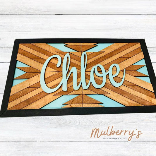 Our personalized name barn quilt is quite impressive! It measures approximately 18" wide by 11" tall. Name can be in print or cursive. Optional stand is available.