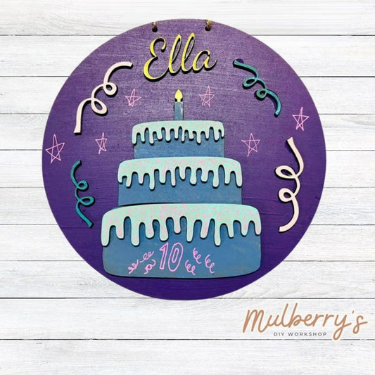 Our mini 9.5" door hanger with a birthday cake is a popular project for kids! This design can be personalized with a name in either print or cursive.