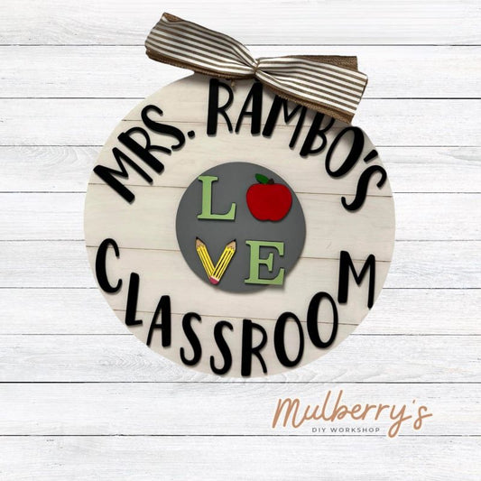 Personalize your own 18" classroom door hanger with your name! This door hanger is interchangeable and comes with your choice of one school-related insert: LOVE, Pencil, or Be Kind Rainbow. Additional inserts may be purchased separately. Many teachers love using our seasonal interchangeable large plate inserts for this door hanger too.