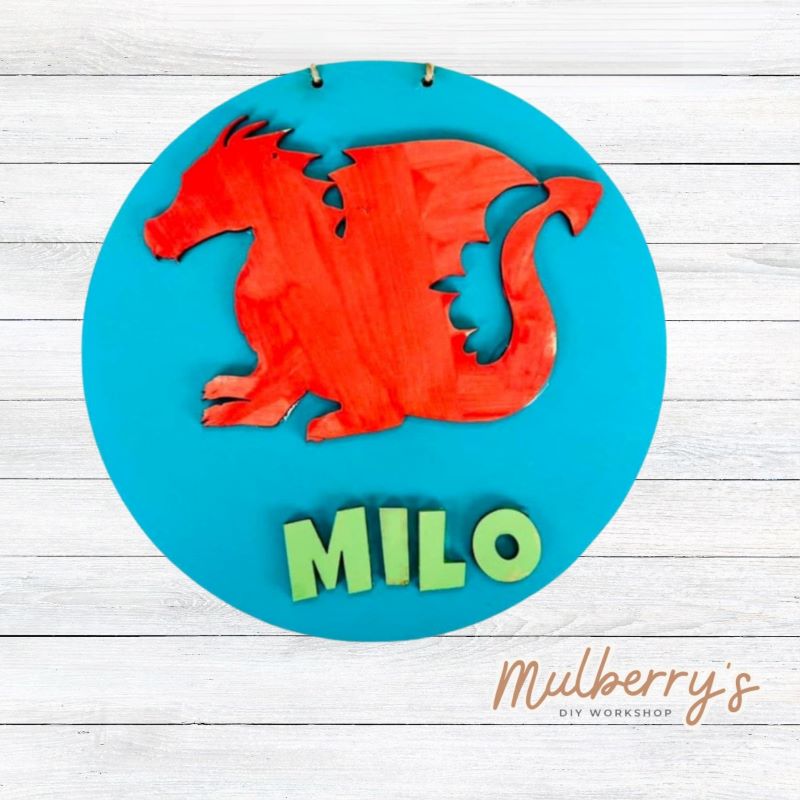 Our mini 9.5" door hanger with a dragon and is a popular project for kids! This design can be personalized with a name in either print or cursive.