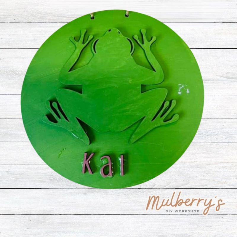 Our mini 9.5" door hanger with a frog and is a popular project for kids! This design can be personalized with a name in either print or cursive.