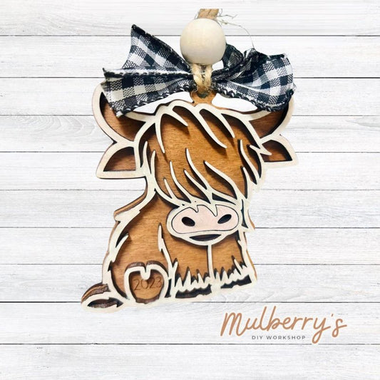 Our personalized highland cow ornament is the perfect addition to your farmhouse Christmas tree! Personalize it with the current year! Approximately 4.5" tall.