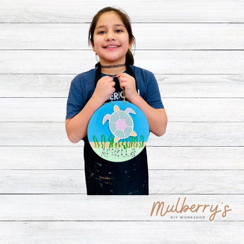 Our mini 9.5" door hanger with a sea turtle and is a popular project for kids! This design can be personalized with a name in either print or cursive.