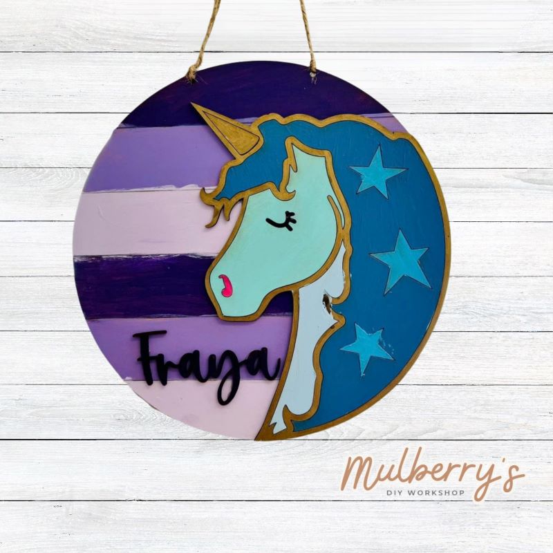 Our mini 10.5" door hanger with a unicorn and is a popular project for kids! This design can be personalized with a name in either print or cursive.