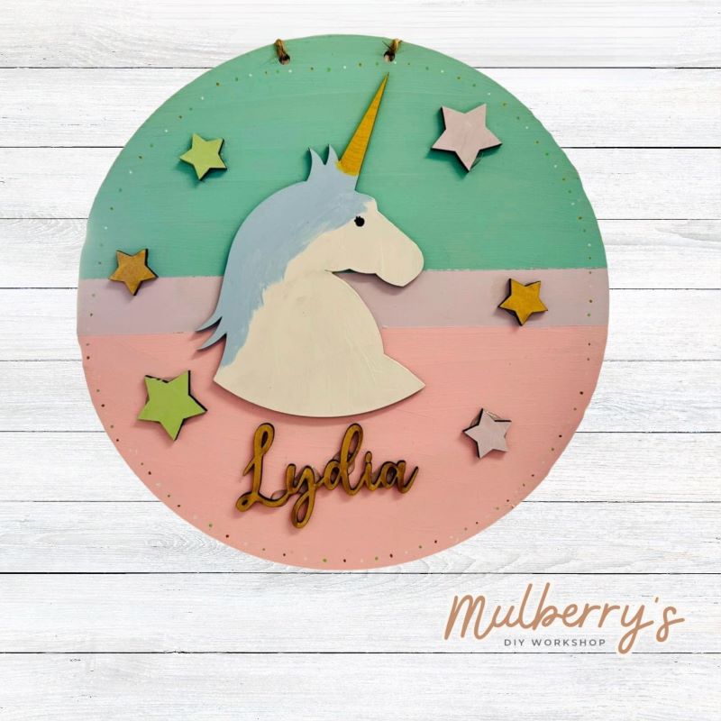 Our mini 9.5" door hanger with a unicorn and is a popular project for kids! This design can be personalized with a name in either print or cursive.